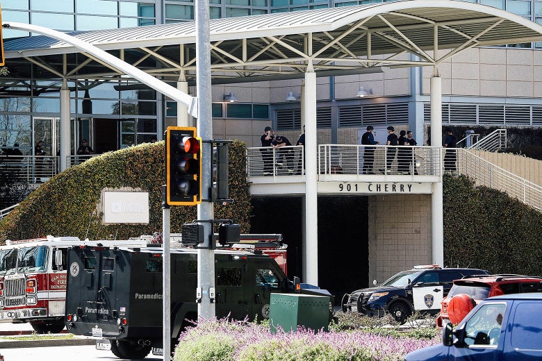 Police officers stand by in front of the YouTube headquarters on Tuesday in San Bruno, California.